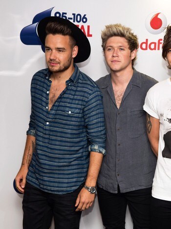 BRITAIN-ENTERTAINMENT/ Members of the pop group One Direction pose for photographers at the Capital Summertime Ball at Wembley Stadium in London, Britain
