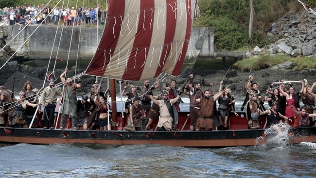 SPAIN-CULTURE/ People dressed as Vikings sail on a boat during the annual Viking festival of Catoira in north-western Spain
