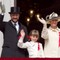 Kronprins Haakon, prinsesse Ingrid Alexandra (7) og kronprinsesse Mette-Marit vinker til barnetoget.