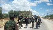 SYRIA/ Members of the Free Syrian Army walk as they carry RPGs at Bab Al Hawa in outskirts of Idlib, near the Syrian-Turkey border
