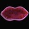 Denne langstrakte cellen ser ut som et neon-skilt og kan til forveksling ligne Salvador Dalis 'Mae West Lips Sofa'.