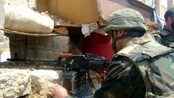 En soldat fra regjeringshæren i Syria i Qusayr