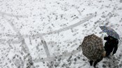 Sludd og regn (Foto: Christian Hartmann/Scanpix/Reuters)