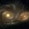 NGC 2207 og IC 2163 er to spiralgalakser på kollisjonskurs. Om ca. en milliard år vil de slå seg sammen til en ellipsegalakse.