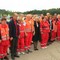 Frivillige fra Røde Kors hjelpekorps, helseminister Anne-Grete Strøm-Erichsen og president i Røde Kors, Sven Mollekev, markerer et minutts stillhet etter tragedien på Utøy. 
