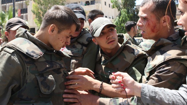 Sårede soldater i Syria (Foto: LOUAI BESHARA/Afp) Sårede soldater i Syria (Foto: LOUAI BESHARA/Afp)
