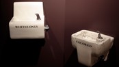 USA/ Segregated drinking fountains from the state of Alabama are displayed at the 'Jim Crow Museum of Racist Memorabilia' at Ferris State University in Big Rapids