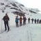 Nasjonaldagen feires også til fjells. En turglad gjeng er på vei opp til Gaustatoppen.