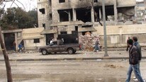 SYRIA People look at a damaged house in Homs (Reuters/Scanpix) SYRIA People look at a damaged house in Homs (Reuters/Scanpix)