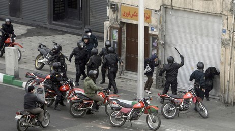Iranian security forces on motorcycles surround opposition protesters during clashes in Tehran on De (Scanpix/AFP)