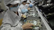 Kinesiske arbeidere ved en Foxconn-fabrikk i Schenzhen