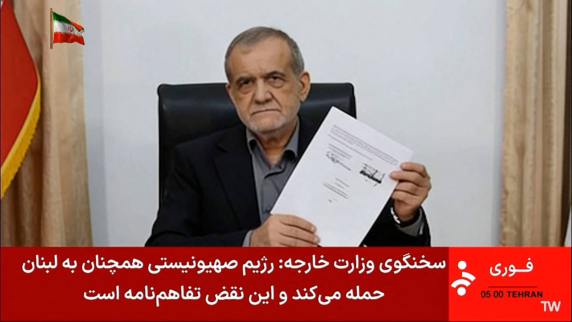  president signerte intensjonavtalen mellom USA og Iran, bildet er tatt fra Irans IRINN statelige TV-sending