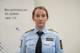 DKOS / NRK Politiadvokat Sigrid Fagerli i Østfold politidistrikt som står foran et kamera i politiuniform.