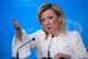 Photo: Pavel Bednyakov / AP / NTB A woman sits at a table with microphones, gesturing with her hand. She is wearing a white blouse with a bow. The background is in a light blue tone.