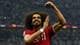 Molly Darlington / REUTERS,NTB Fotballspiller Akram Afif jubler med armene hevet på Lusail stadion. Han har på seg en rød drakt med nummer 11. I bakgrunnen er det tilskuere. (Bildebeskrivelsen er laget av en KI-tjeneste)