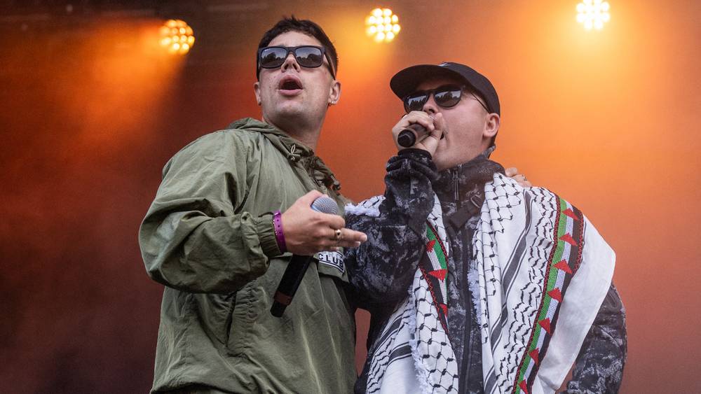 two men with sunglasses and sing