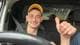 Privat / Privat Sergiu Tincaburov smiler og viser tommel opp, han sitter bak rattet i en bil.