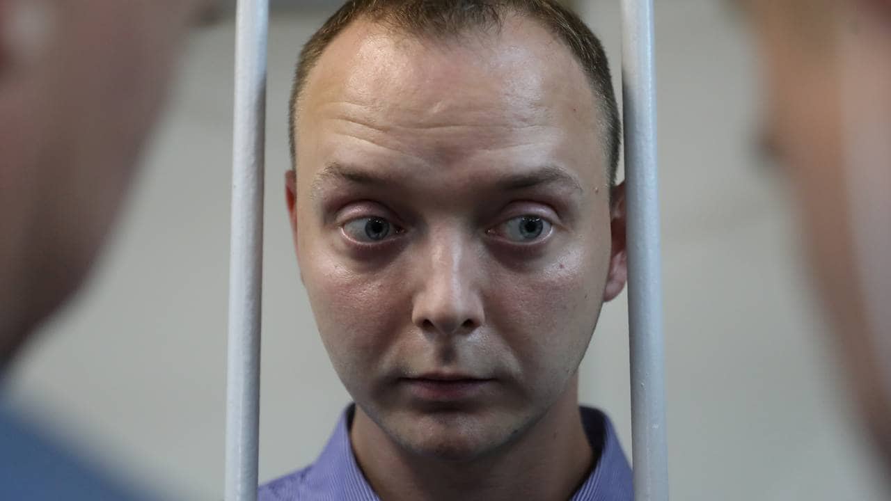 Ivan Safronov, a former journalist who works as an aide to the head of Russia's space agency Roscosmos, detained on suspicion of treason attends a court hearing in Moscow