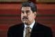 JUAN BARRETO / AFP / NTB Nicolas Maduro med bart og dress og slips