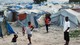 Foto: Jorge Silva / Reuters FILE PHOTO: 2011 photo shows Haitians made homeless in previous year's earthquake standing outside their tents