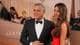 AP George Clooney sammen med sin kone.