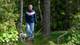 Lars Tore Endresen / NRK En person som går tur med en hund i skogen