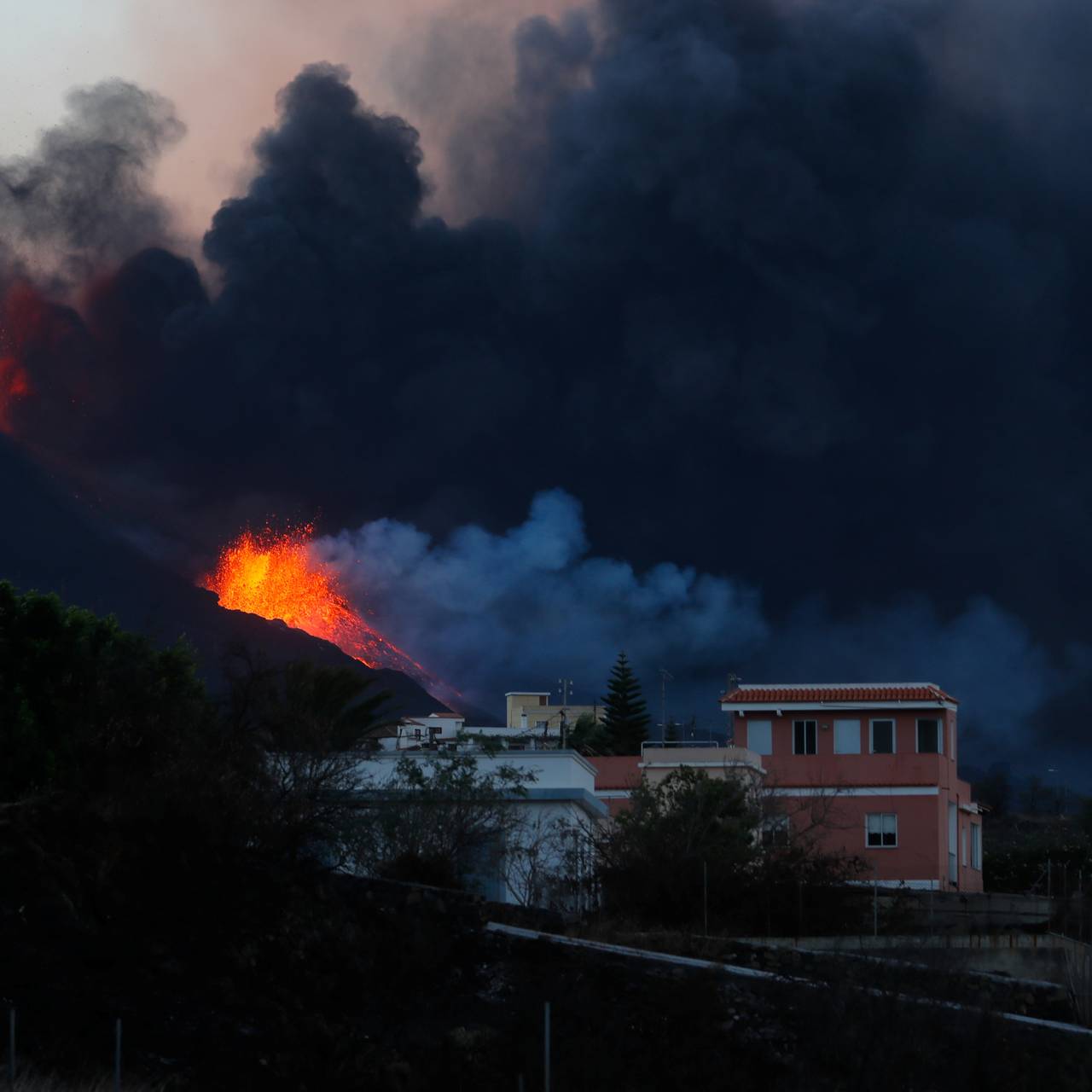 Smoke and lava rise from the crater after lava flowed into the sea following the eruption of a volcano on the Canary Island of La Palma