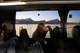 Foto: Sindre Lønnes / NRK Mari Aspevold Kristiansen (16) sitter på skolebussen, en grytidlig morgen i Steigen i Nordland. Bilde til XL om skoleskyss.