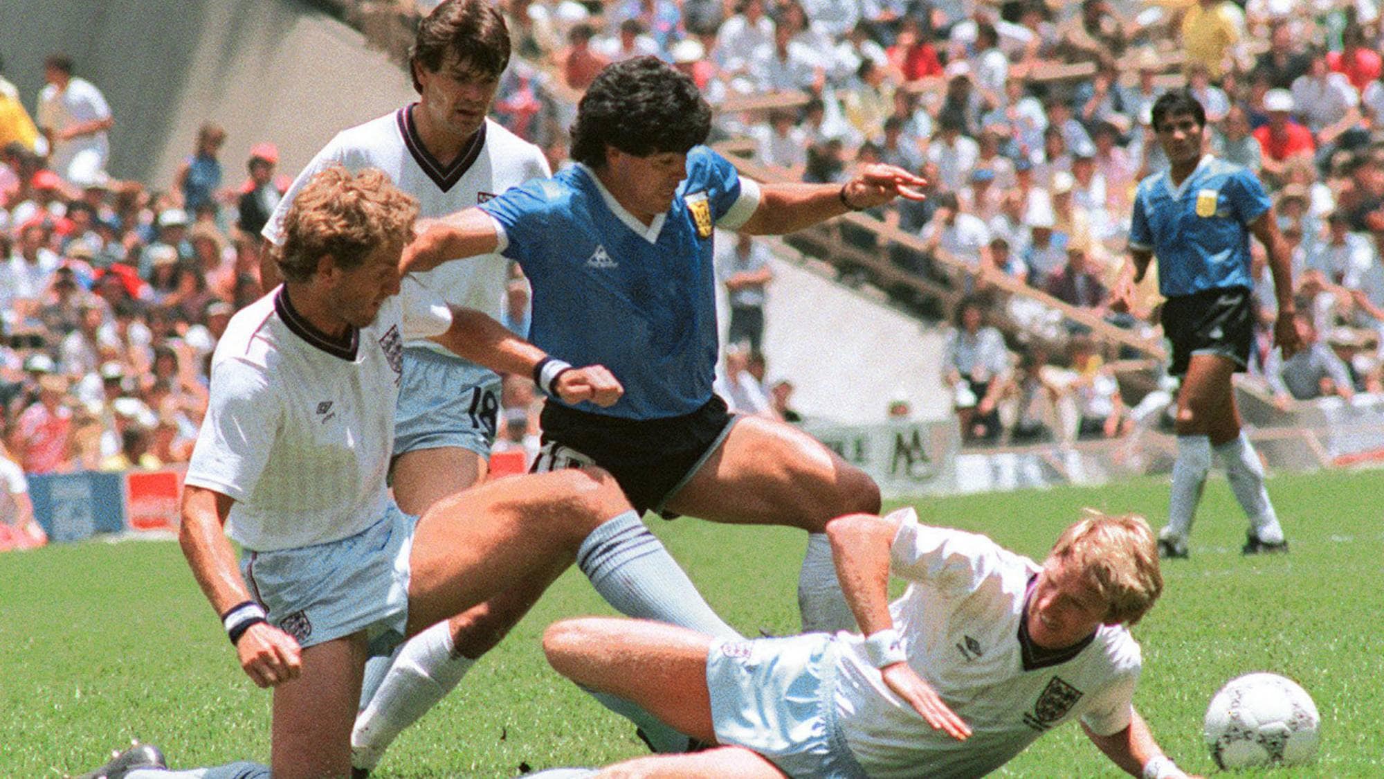 (FILE) Picture taken 22 June 1986 in Mexico City of Argentinian midfielder Diego Maradona (C) during the World Cup quarterfinal soccer match between Argentina and England. Maradona scored two goals, the first one with his left hand as he jumped for the ball in front of goalkeeper Peter Shilton, as Argentina beat England 2-1. Tomorrow 22 June 2006 this historical goal, about what Maradona had said it was made by "the God's hand", will have its 20 anniversary. AFP PHOTO