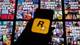 Foto: AFP This illustrtation shows a logo of Rockstar Games on a smartphone screen and covers of video game...