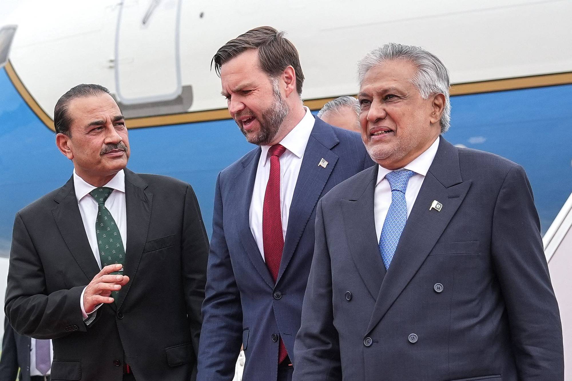 (FILES) US Vice President JD Vance (C) speaks with Army Chief and Field Marshal Syed Asim Munir (L) and Pakistan's Foreign Minister Ishaq Dar after arriving for the US-Iran peace talks in Islamabad on April 11, 2026. Over a feverish few days of diplomacy, Pakistan's military and civilian politicians successfully divided the Middle East between them to push for a second round of US-Iran peace talks expected to take place in Islamabad this week. (Photo by Jacquelyn MARTIN / POOL / AFP)