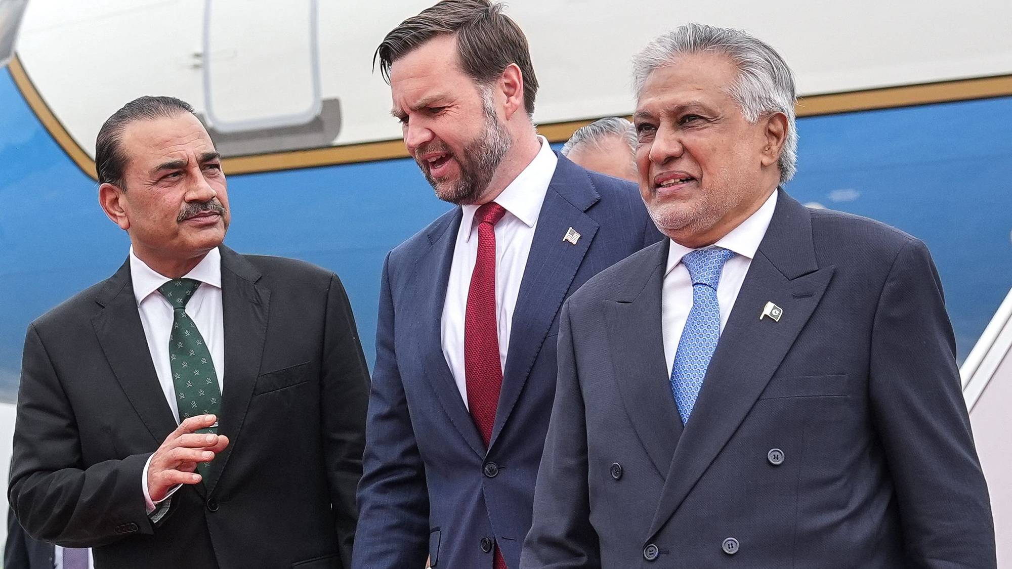 (FILES) US Vice President JD Vance (C) speaks with Army Chief and Field Marshal Syed Asim Munir (L) and Pakistan's Foreign Minister Ishaq Dar after arriving for the US-Iran peace talks in Islamabad on April 11, 2026. Over a feverish few days of diplomacy, Pakistan's military and civilian politicians successfully divided the Middle East between them to push for a second round of US-Iran peace talks expected to take place in Islamabad this week. (Photo by Jacquelyn MARTIN / POOL / AFP)