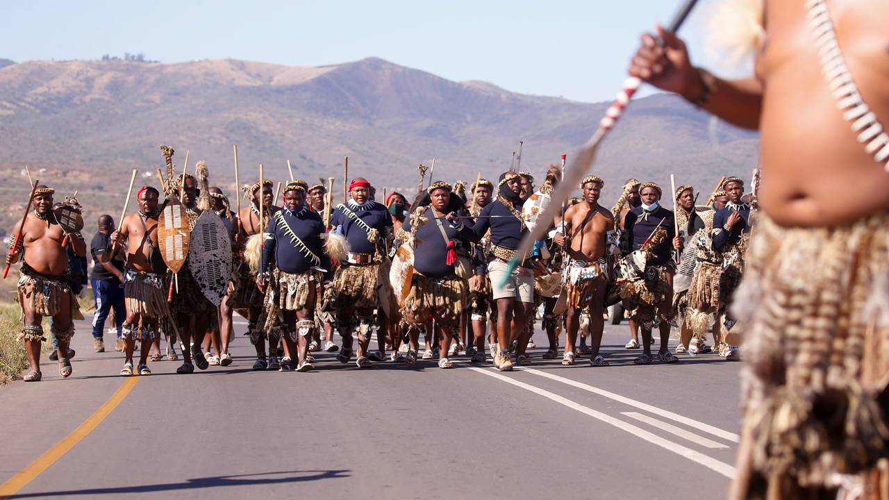 Supporters of former South African President Jacob Zuma walk to his home in Nkandla