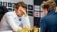 Fredrik Varfjell / NTB To sjakkspillere sitter ved et brett. En mann med skjegg sitter lent fremover med hånden mot pannen. En annen spiller sitter vendt bort fra kameraet. Bak dem henger logoer og ordet "CHESS". (Bildebeskrivelsen er laget av en KI-tjeneste)