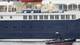Ismail Burak Akkan / NRK Virusskipet MV Hondius kommer til Granadilla havn. Passasjerene skal fraktes til Tenerife Sør Lufthavn etter det.