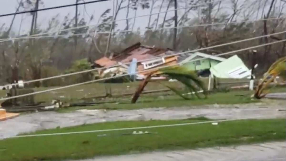 Uprooted trees, fallen power lines and the debris from damaged houses scattered on road as Hurricane Dorian sweeps through Marsh Harbour, Bahamas