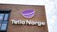 NTB Telia Norge- logo på murvegg.