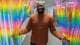 Petter Larsson / NRK Stephen Adom tar et pride-forheng til side mens han smiler stort