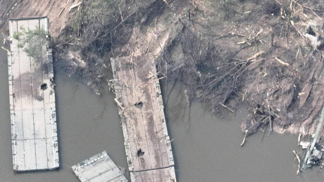 The remains of what appears to be a makeshift bridge across the Siverskyi Donets River