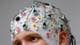 Reuters en person med en EEG-hette