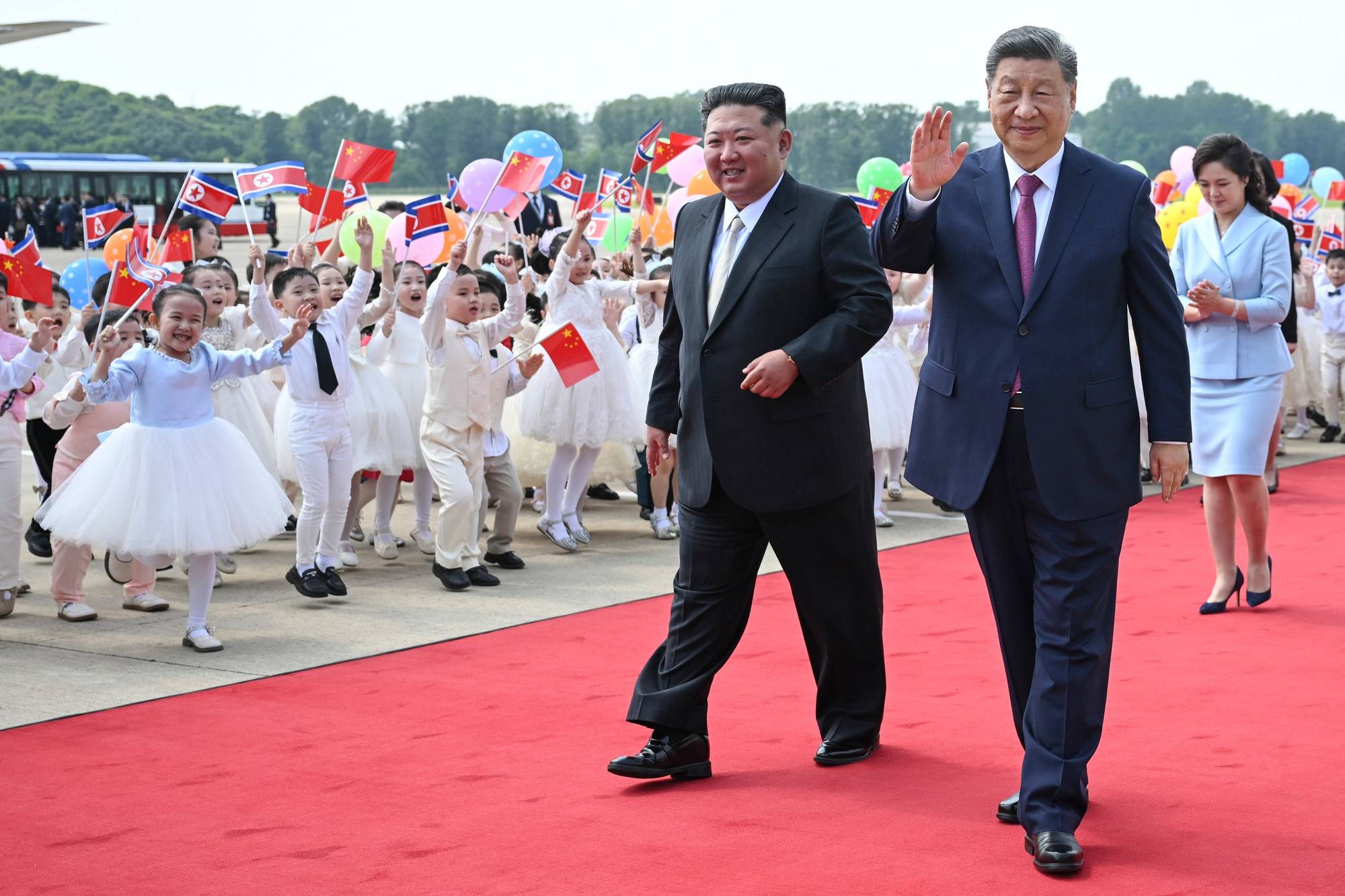 Kim Jong-un og Xi Jinping i Pyongyang