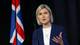 Leonhard Foeger / REUTERS,NTB Iceland's Prime Minister Kristrun Frostadottir taler ved en talerstol med det islandske flagget i bakgrunnen. (Bildebeskrivelsen er laget av en KI-tjeneste)