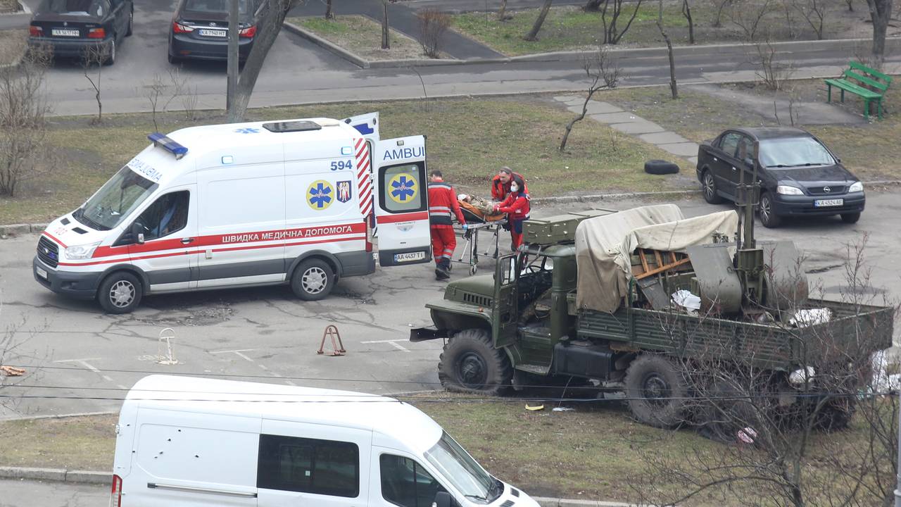 A view shows a damaged unidentified military truck at a residential area in Kyiv