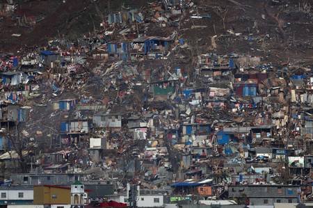 Foto: Yves Herman / Reuters Raserte skur i en åsside