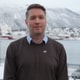 Petter Moen Nilsen / NRK Marius Hansen outdoors with a snowy fjord in the background