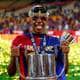 Lamine Yamal shows off the trophy for the victory in the Spanish cup with two pairs of sunglasses on his head.