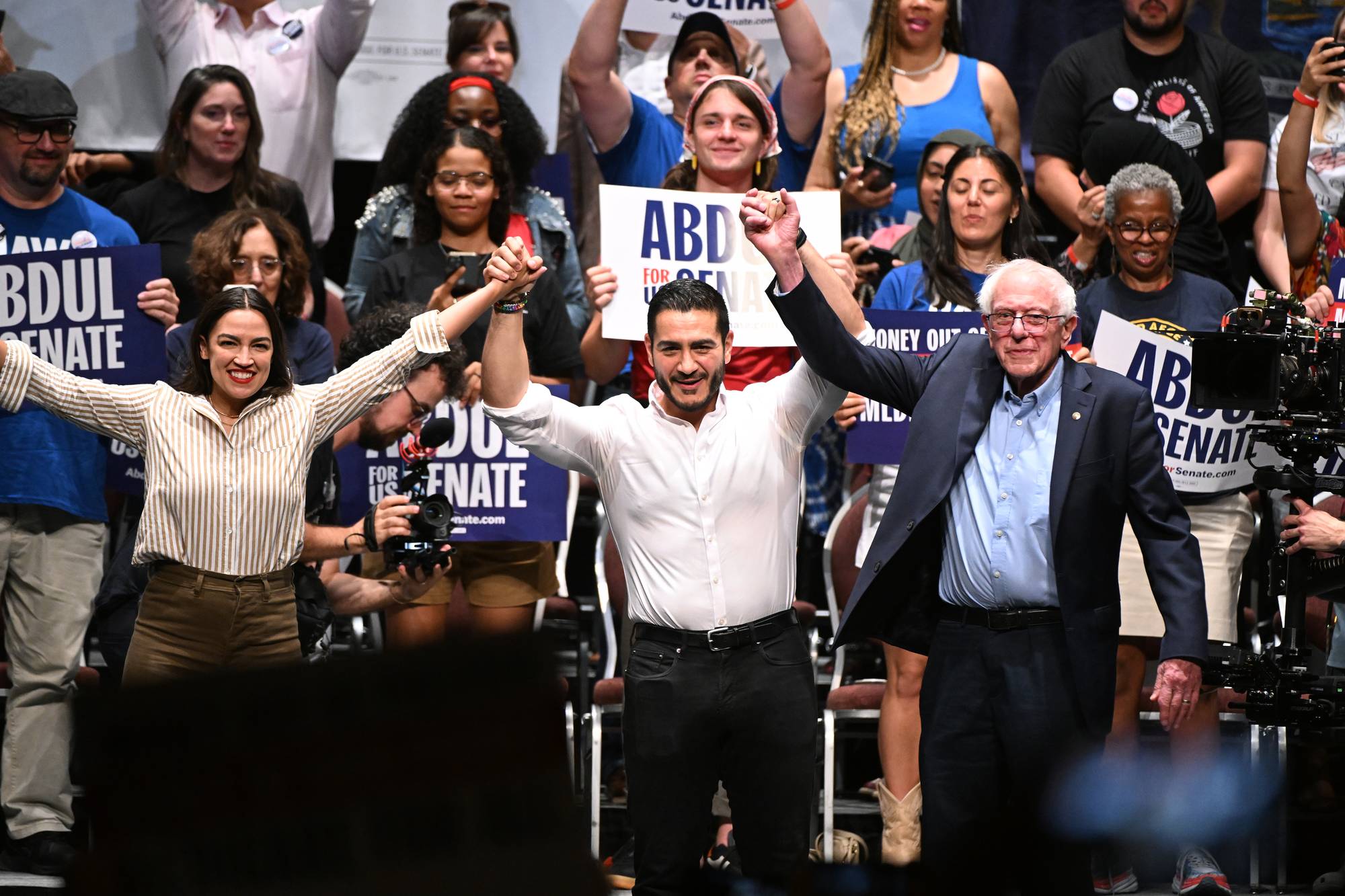 From left foreground, U.S. Rep. Alexandria Ocasio-Cortez, D-N.Y., Michigan Democratic U.S. Senate primary candidate Abdul El-Sayed, and U.S. Sen. Bernie Sanders.