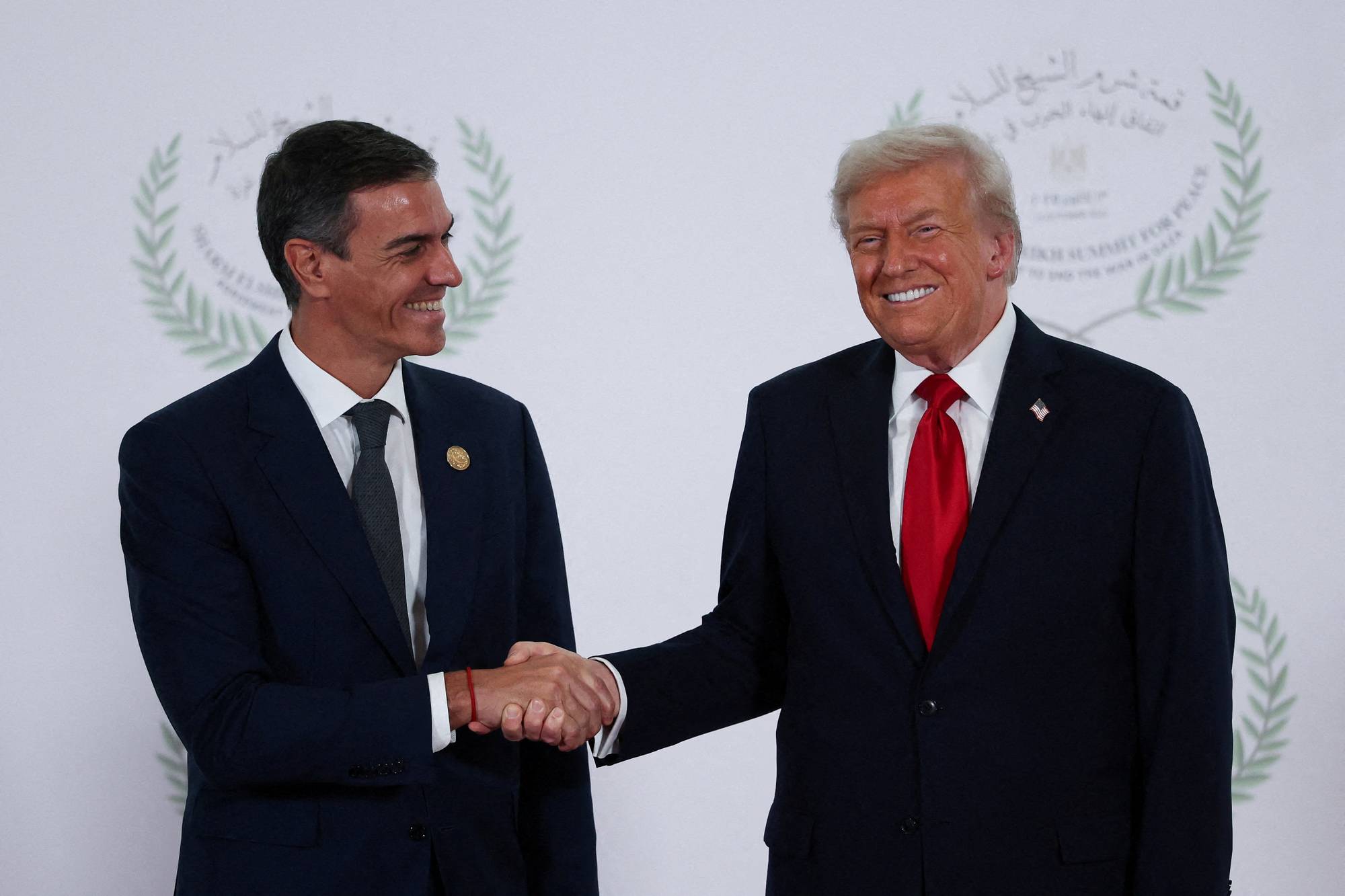 U.S. President Donald Trump and Spanish Prime Minister Pedro Sanchez shake hands
