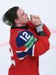 SEBASTIEN BOZON / AFP,NTB Ishockeyspiller med nummer 12 på drakten jubler på isen. Han har hendene samlet foran munnen. Bildet er tatt på nært hold. (Bildebeskrivelsen er laget av en KI-tjeneste)