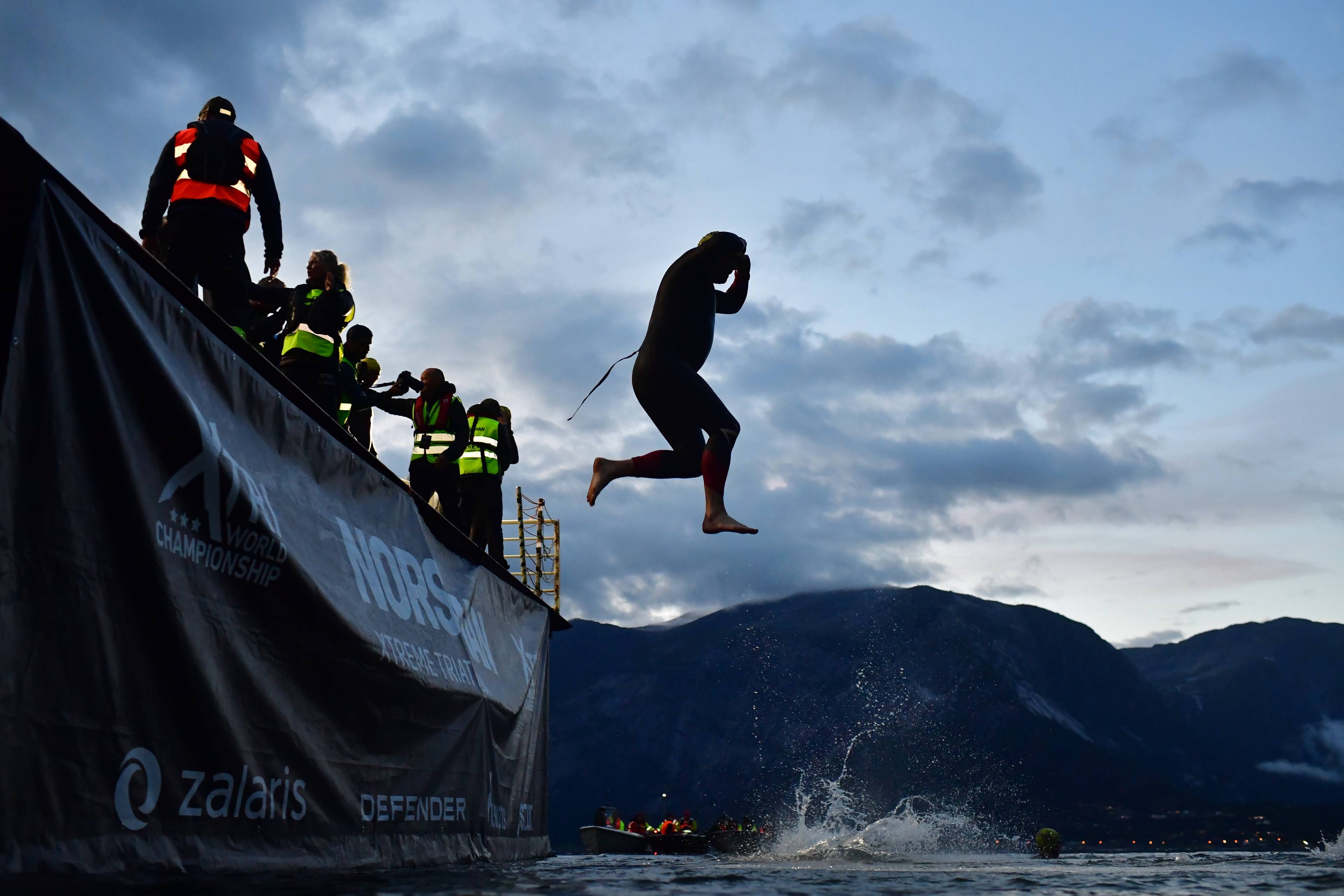 Athletes are seen during the jump of the ferry prior the Norseman Extreme Triathlon on August 01, 2026, in Eidfjord, Norway.